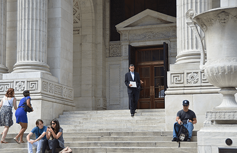 Man in suit leaving a building